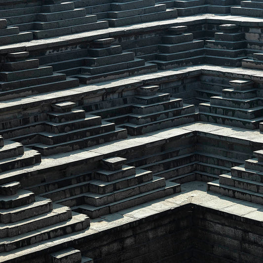 Hampi - Eternal Echoes: Shadows and Stone in Hampi's Geometric Steps (with Frame)