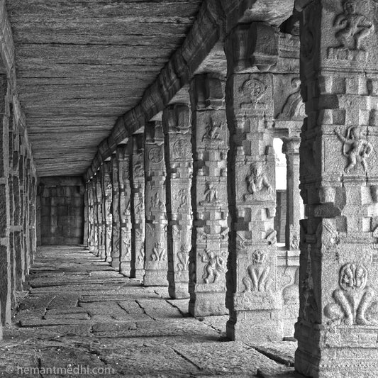 Stone Carved Pillers passage in a temple. Hampi. (0483Hampi) A World Heritage Site situated in Karnataka, India. This is located at Actutray Temple, Hampi. A Unesco World Heritage Site. Indian Heritage, Art and Culture. Fine Art Photography on Canvas Printing Indian Temples Fine Art Culture Carving Stone Black and White black&white B&W World Heritage Site BW Hampi