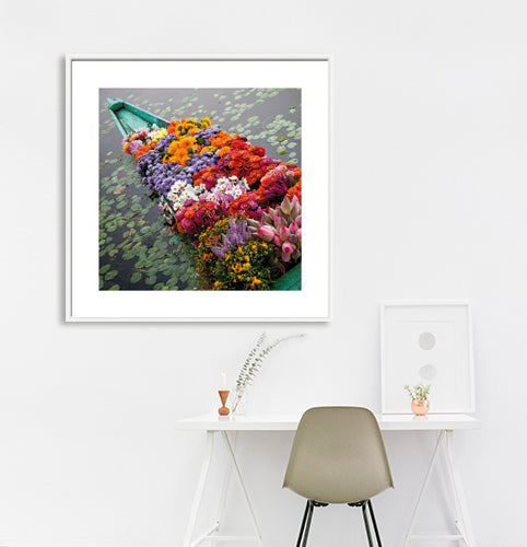 Ladakh is most famous for breathtaking landscapes, the crystal clear skies, the highest mountain passes, thrilling adventure activities, Buddhist Monasteries and festivals. (_MG_5365 Ladakh Col) This Fine Art Photograph is printed on Canvas. Colourful Flowers in a boat