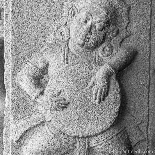 Drummer carved in stone on a pillar at Vijayvitthala Temple Hampi. (_MG_7069 Hampi) A Unesco World Heritage Site situated in Karnataka, India. Indian Heritage, Art and Culture. This Fine Art Photograph is printed on Canvas. Available in 9x9 inches, 12x12 inches and 24x24 inches. Customised sizes are also available on request. Fine Art Photography on Canvas Printing Indian Temples Fine Art Culture Carving Stone Black and White black&white B&W World Heritage Site BW Hampi