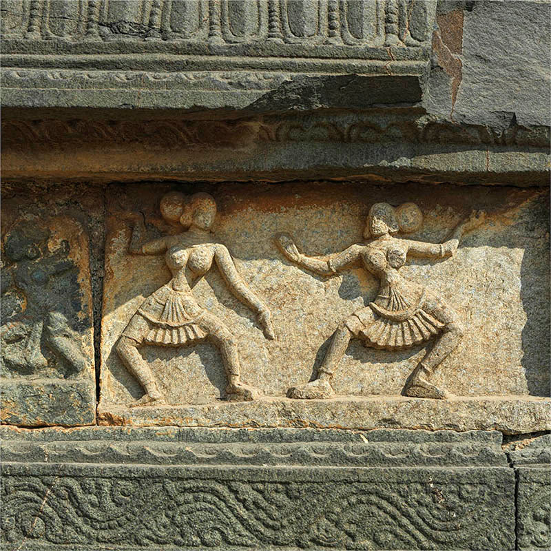 The "Dancing Ladies," one of the most famous elements of the Mahanavmi Dibba, are gracefully etched into the stone. These elegant sculptures capture the essence of the dance forms prevalent during the 14th century. Their poised stances, intricate jewelry, and ornate attire provide a glimpse into the aesthetics and sophistication of the Vijayanagara period.
