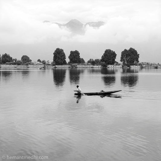 Srinagar - Nageen Lake. Nigeen Lake is a mildly eutrophic lake located in Srinagar, Jammu and Kashmir, India. It is sometimes considered a part of the Dal lake and is connected to it via a narrow strait. (_MG_5229 Srinagar)   This Fine Art Photograph is printed on Canvas.