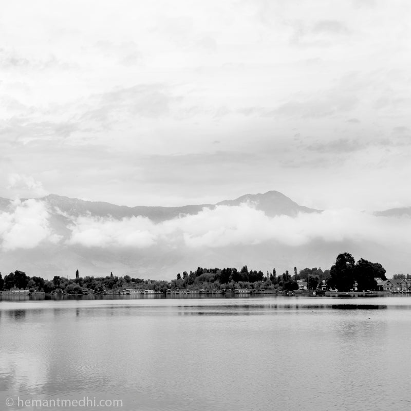 Srinagar - Nageen Lake. Nigeen Lake is a mildly eutrophic lake located in Srinagar, Jammu and Kashmir, India. It is sometimes considered a part of the Dal lake and is connected to it via a narrow strait. (_MG_5245 Srinagar)   This Fine Art Photograph is printed on Canvas.