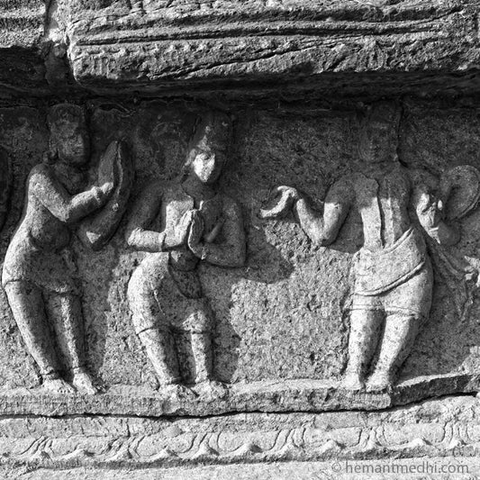 Stone Carving at Hampi, a World Heritage Site situated in  Karnataka, India. This is located at Mahanavmi Dibba, Hampi. Indian Heritage, Art and Culture.   A beautiful composition of the Guru Shishya (Teacher and Students). (0142Hampi)  Carved in stone at the basement of Mahanavmi DIbba area. Fine Art Photography on Canvas Printing Indian Temples Fine Art Culture Carving Stone Black and White black&white B&W World Heritage Site BW Hampi 