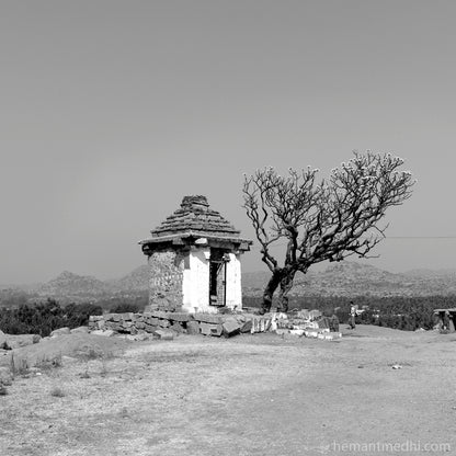 Temple view at Hemkuta. Hampi, a World Heritage Site situated in Karnataka, India. (0336Hampi) This is located at Hemkuta, Hampi. Indian Heritage, Art and Culture.   This Fine Art Photograph is printed on Canvas.  Fine Art Photography on Canvas Printing Indian Temples Fine Art Culture Carving Stone Black and White black&white B&W World Heritage Site BW Hampi 
