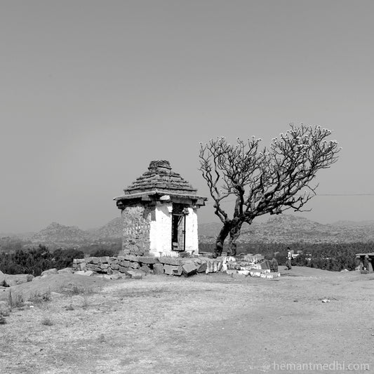 Temple view at Hemkuta. Hampi, a World Heritage Site situated in Karnataka, India. (0336Hampi) This is located at Hemkuta, Hampi. Indian Heritage, Art and Culture.   This Fine Art Photograph is printed on Canvas.  Fine Art Photography on Canvas Printing Indian Temples Fine Art Culture Carving Stone Black and White black&white B&W World Heritage Site BW Hampi 