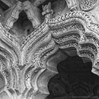 Arch clouse-up at Lotus Mahal. (0390Hampi) Hampi, a World Heritage Site situated in Karnataka, India. This is located at Hemkuta, Hampi. Indian Heritage, Art and Culture.   This Fine Art Photograph is printed on Canvas. Available in 9x9 inches, 12x12 inches and 24x24 inches. Customised sizes are also available on request. Fine Art Photography on Canvas Printing Indian Temples Fine Art Culture Carving Stone Black and White black&white B&W World Heritage Site BW Hampi 