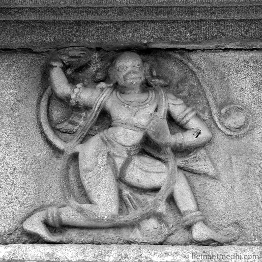 Anjaneya (Hanuman) Carved in Stone. Hampi, a World Heritage Site situated in  Karnataka, India. This is located at Mahanavmi Dibba, Hampi. Indian Heritage, Art and Culture.   This Fine Art Photograph is printed on Canvas. Available in 9x9 inches, 12x12 inches and 24x24 inches. Customised sizes are also available on request. Fine Art Photography on Canvas Printing Indian Temples Fine Art Culture Carving Stone Black and White black&white B&W World Heritage Site BW Hampi 